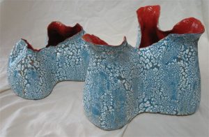 ceramic Outdoor sculpture by Michelle Maher. Inspired by bracket coral and fungi. Hand sculpted in my Dublin based studio. High fired in an electric kiln to 1260°C (Cone 8), white crackle glaze effect over red gloss glaze. www.ceramicforms.com