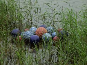 Award winning ceramic water sculpture by Michelle Maher - Pollen Hotspot. Shown here in Clare lake at the Claremorris Open Exhibition, Co. Mayo. The piece is inspired by microscopic pollen grains - measured in nanometers these tiny grains are perhaps natures greatest sculptures. www.ceramicforms.com