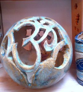 Hand built sphere lamp by Aideen McDonald at Dublin based ceramics weekend course. The piece features the Om symbol ॐ. Electric fired to 1260°C (Cone 8). www.ceramicforms.com