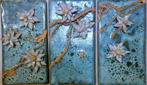 Hand built and modelled wall tiles by Ann Sai at Dublin based Monday evening ceramics course. Decorating slip with combustible mixed media detail. Glazed with a high gloss copper and pearl glaze; electric fired to 1260°C (Cone 8). www.ceramicforms.com