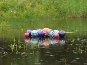 Award winning ceramic water sculpture by Michelle Maher - Pollen Hotspot. Shown here Shown here in the Lochan at Brigit's Garden, Co. Galway. The piece is inspired by microscopic pollen grains - measured in nanometers these tiny grains are perhaps natures greatest sculptures. See www.ceramicforms.com