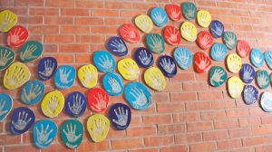Hand Print Project. Large-scale Collaborative Public Art Commission 2009 with St. Peter’s National School, Phibsborough, Dublin. This project celebrated the opening of their new school building and had a strong collaborative element between Ceramic Artist Michelle Maher and the whole school community. We took the handprints in clay and slip of all pupils, teachers and staff and created a series of three large-scale ceramic wall murals. www.ceramicforms.com Photo by Trevor O'Rourke - Picturehouse Photography.