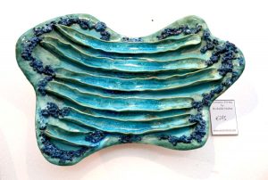 Ceramic wall sculpture - Michelle Maher. SOLD. This wall piece is inspired by coral and fungi; combustible mixed media detail with glass. Hand sculpted and modelled in a grogged stoneware clay body and fired in an electric kiln to 1260°C (Cone 8). www.ceramicforms.com.